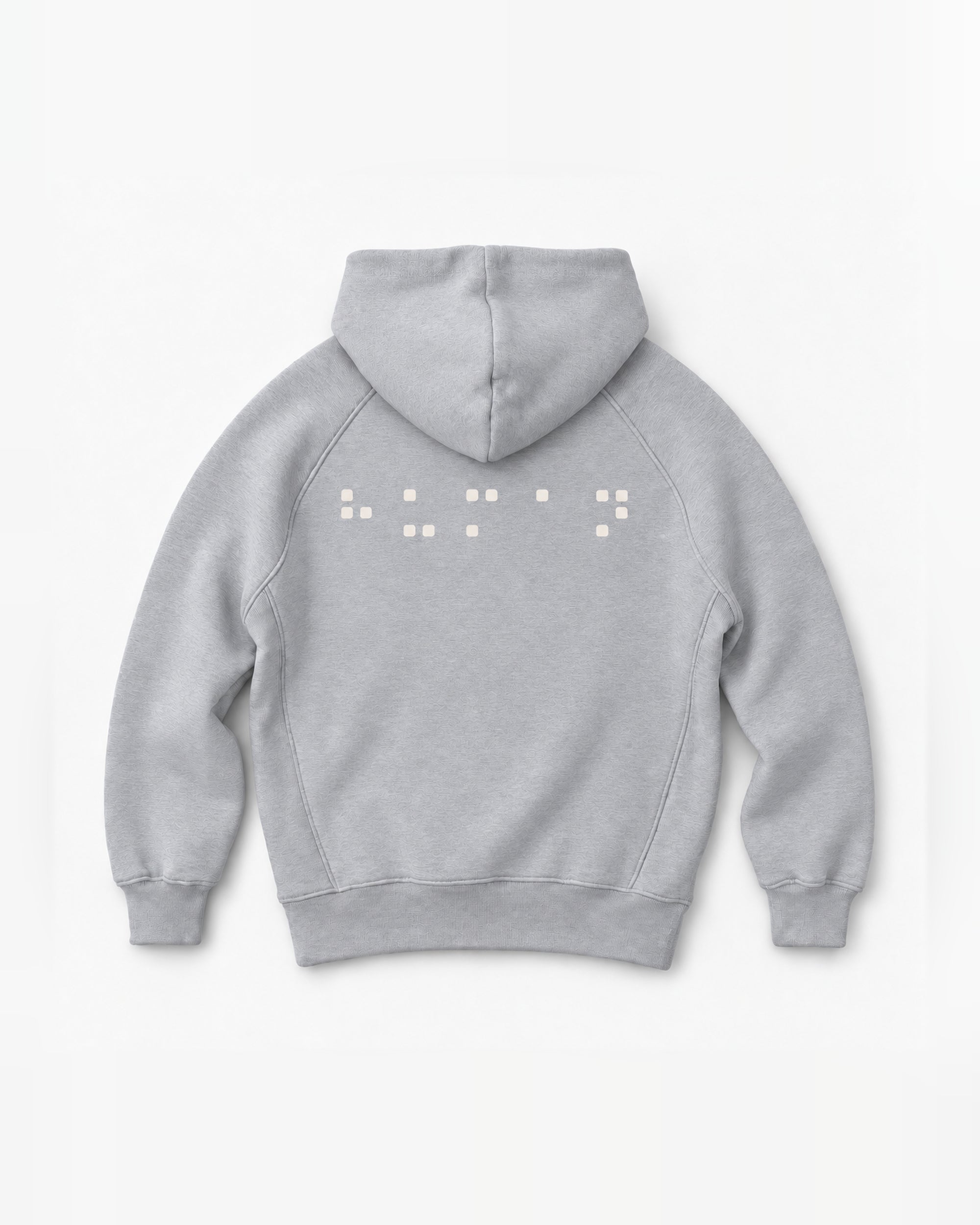 Back mockup of the NAÏYO X Nude Project hoodie with cream square-dot artwork.