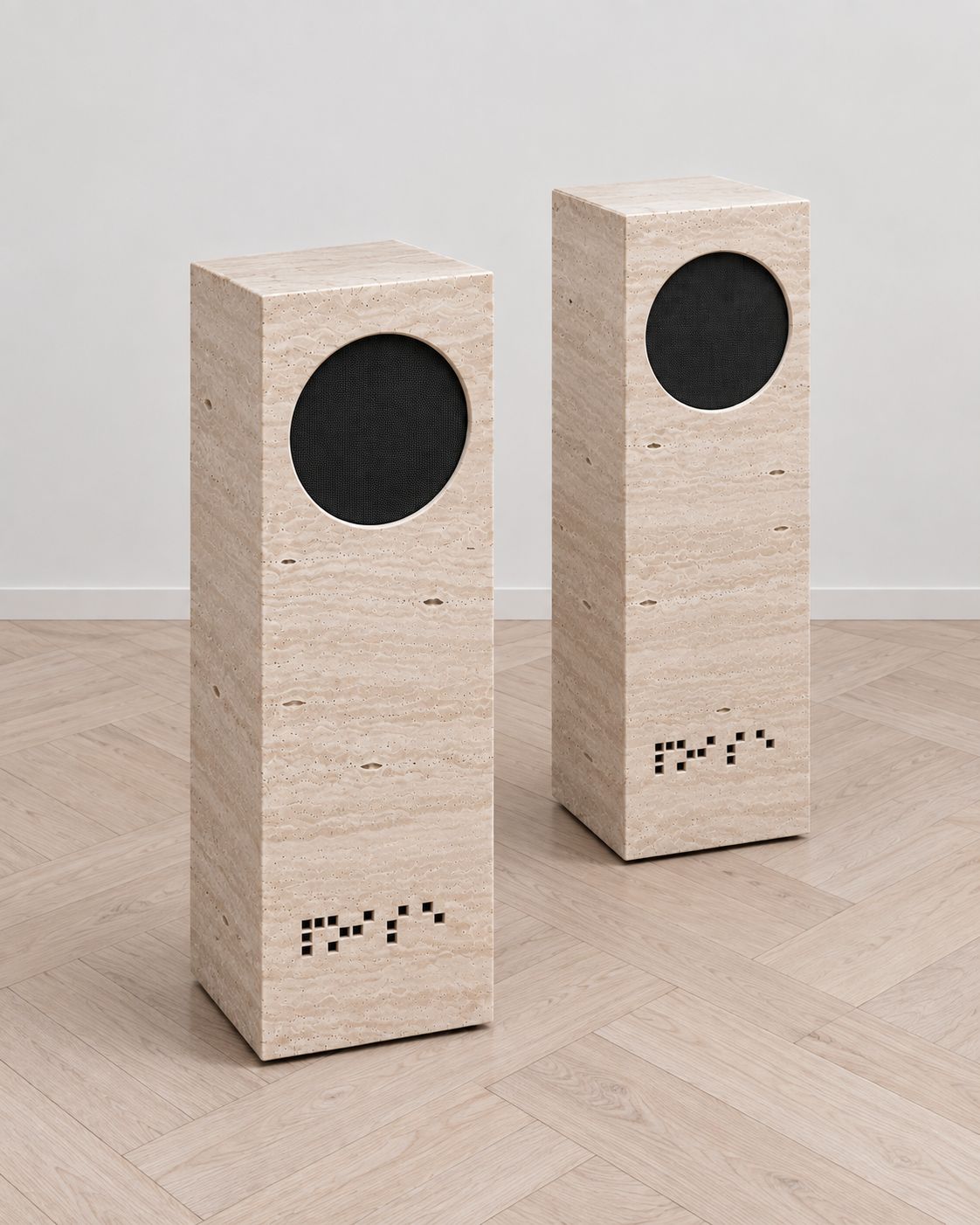 Elevated view of a pair of NOISE travertine speakers.